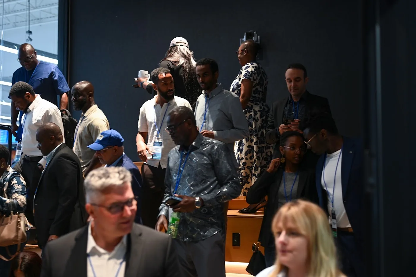 Audience, faculty, and guests in active exchange during the July CI3 event